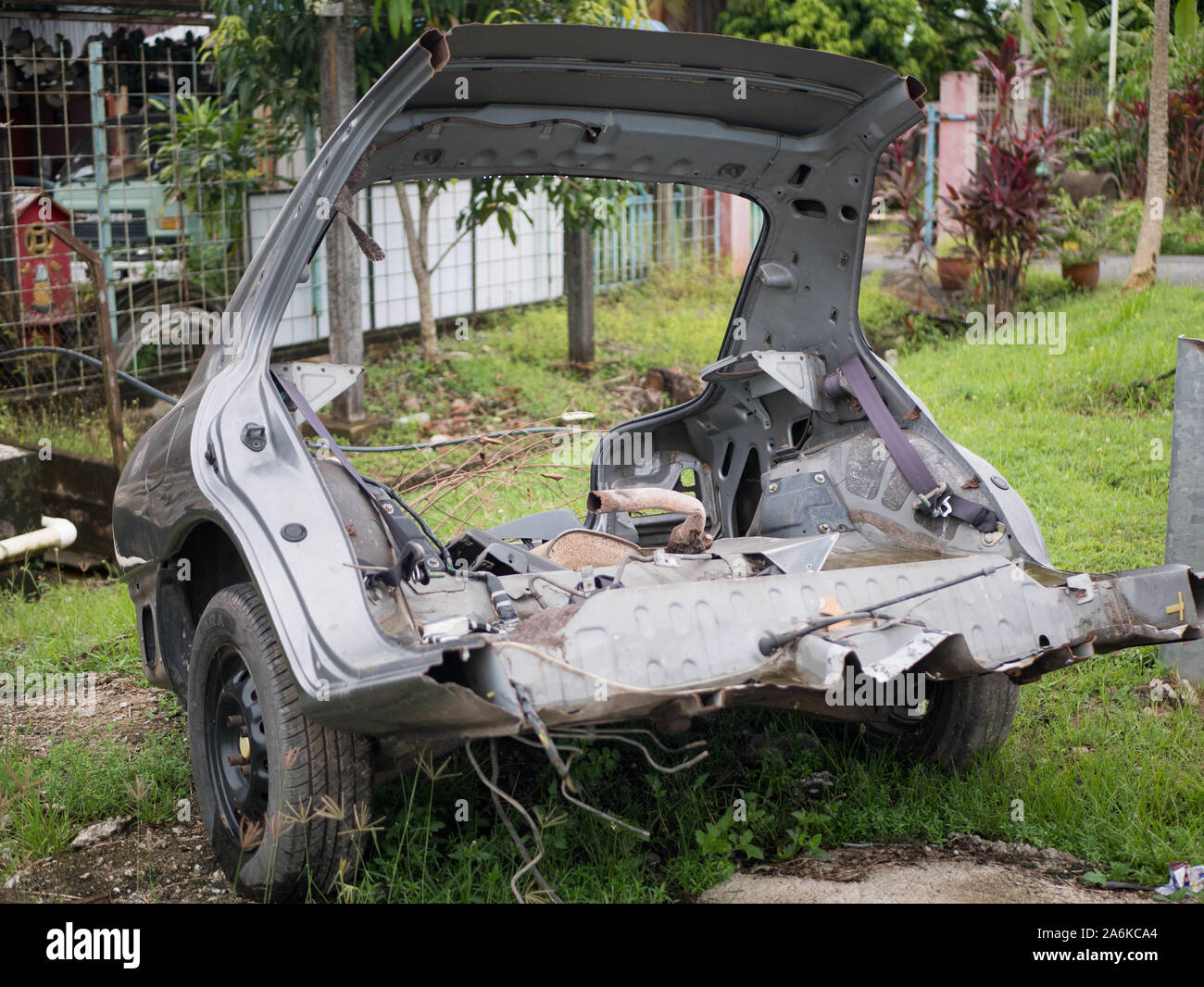 Old rusty half cut car by the road side after the accident at the Stock Photo Alamy