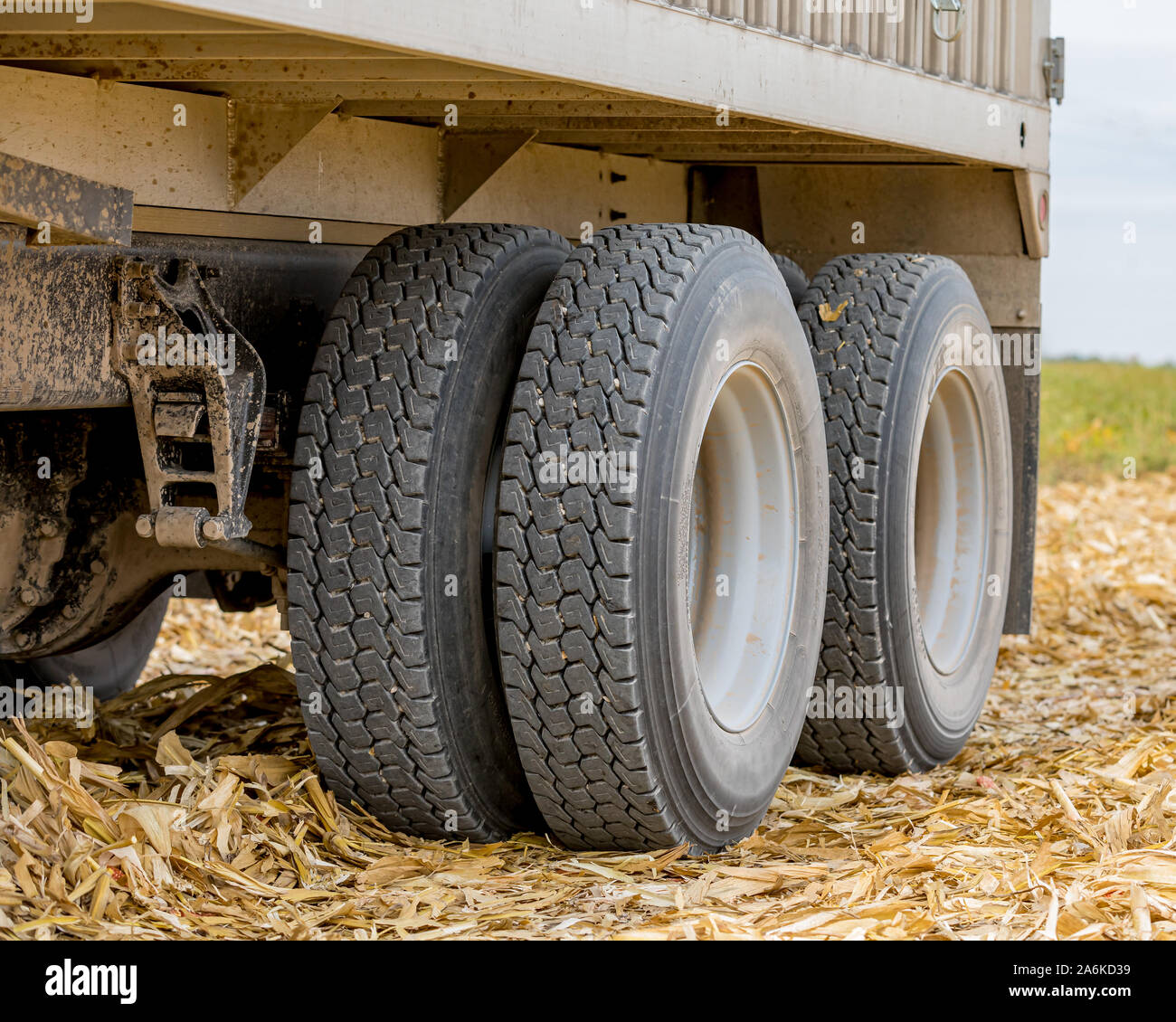 Large grain truck with tandem axle dual wheels with retread rubber