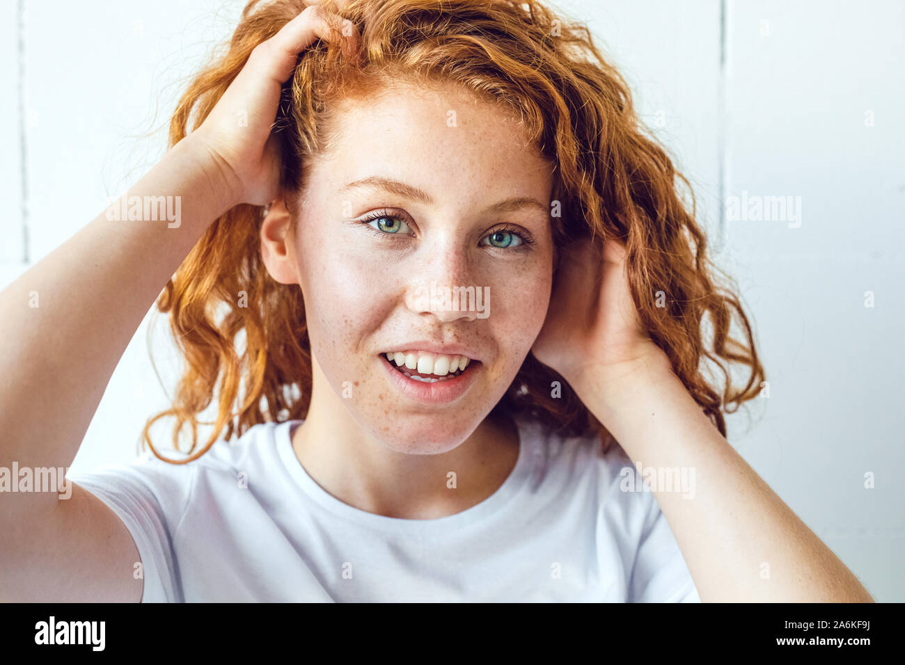 Beautiful smiling redhead girl with freckles. Stock Photo