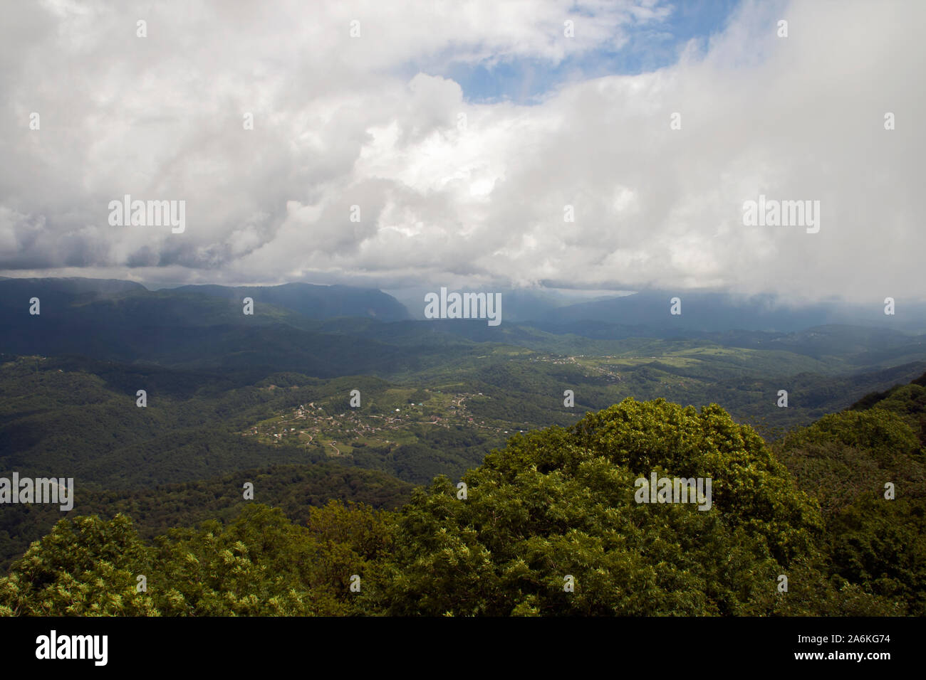 meadow and majestic sky with clouds over the green hills Stock Photo ...
