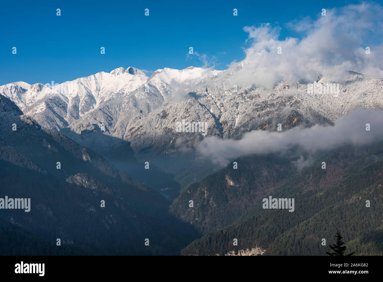 View of Enipeas gorge with the high peaks of Olympus mountain in Greece ...