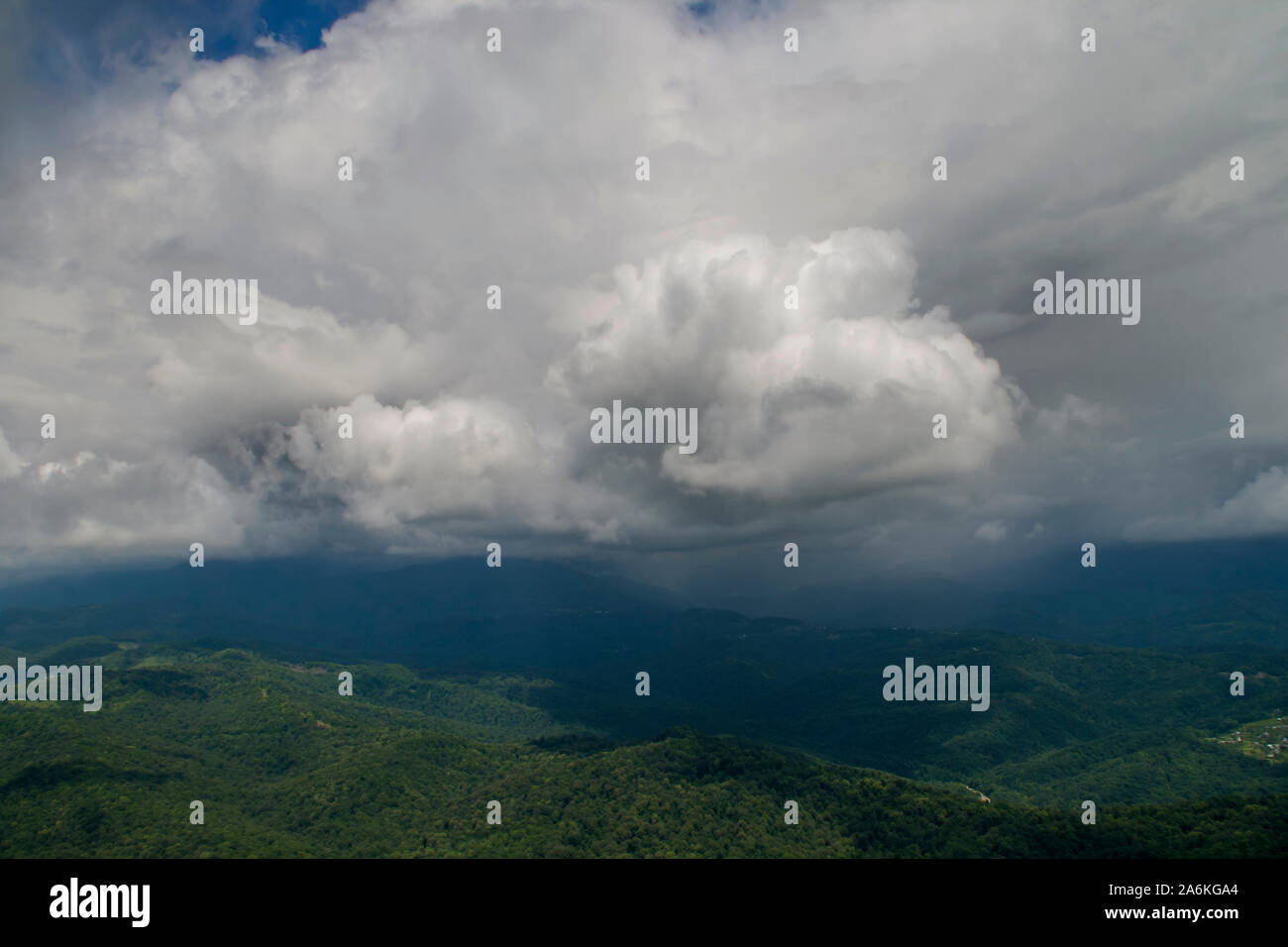 meadow and majestic sky with clouds over the green hills Stock Photo ...