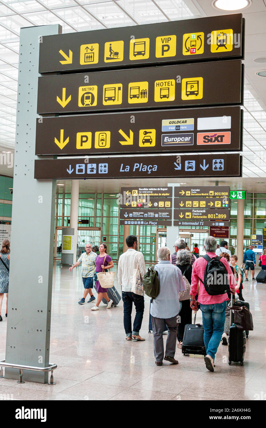 Barcelona Spain,Catalonia Barcelona-El Prat Josep Tarradellas Airport BCN,terminal,sign,international ISO graphical symbols,ground transportation,man, Stock Photo