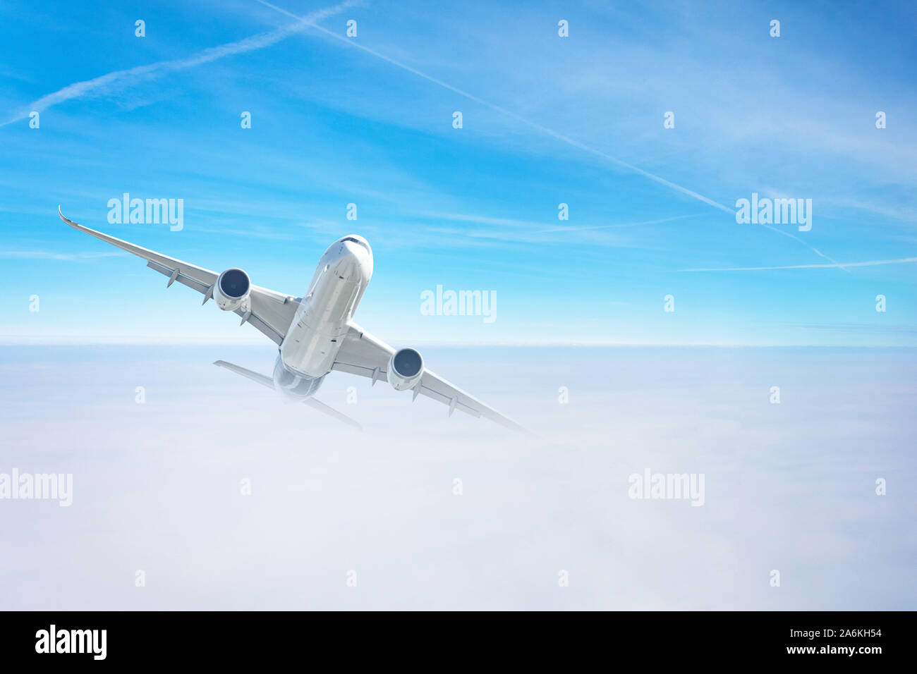 Passenger airplane gains altitude flying through a dense cloud layer