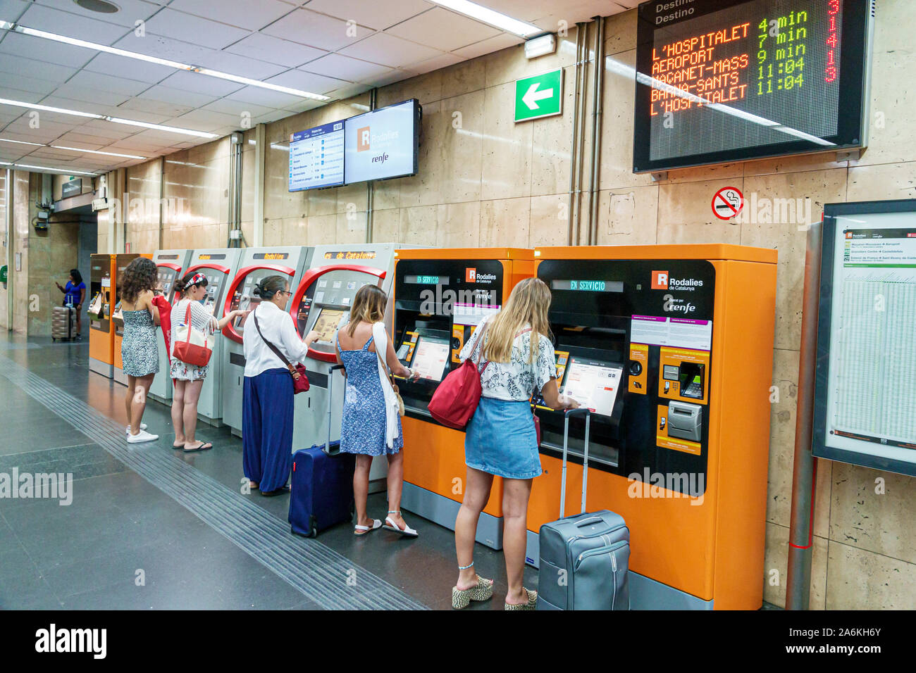 Barcelona Spain,Catalonia El Clot-AragÃƒÂ³ Rodalies de Catalunya train station,ticket vending machines,woman,commuter,man,woman,couple,Hispanic,ES1908 Stock Photo