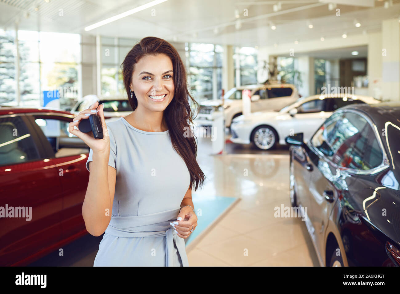 A male buyer is sitting in a new car. Stock Photo