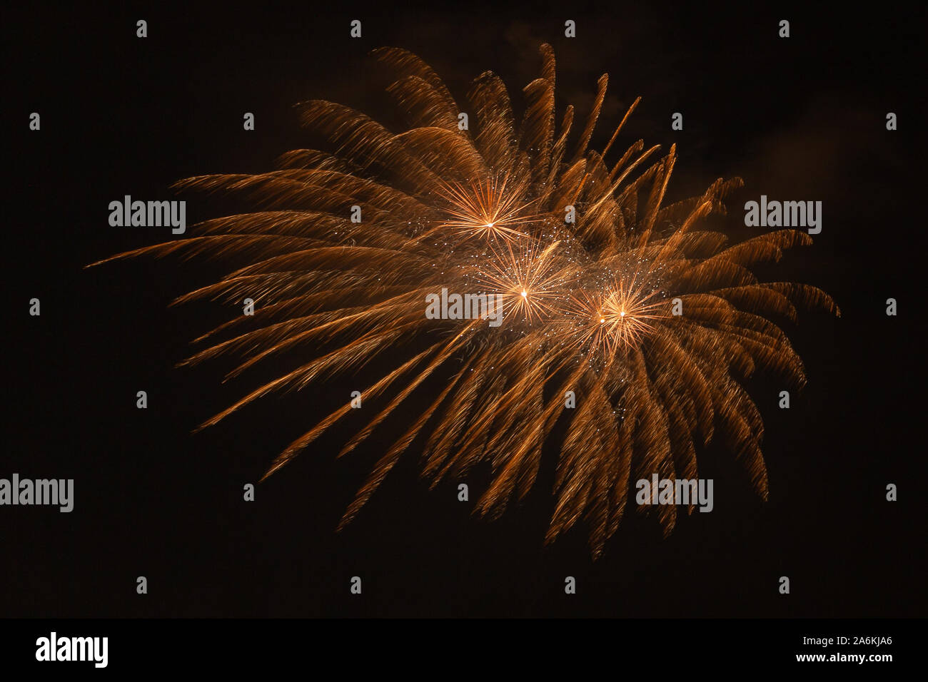 Awesome golden fireworks against the backdrop of the night sky Stock Photo
