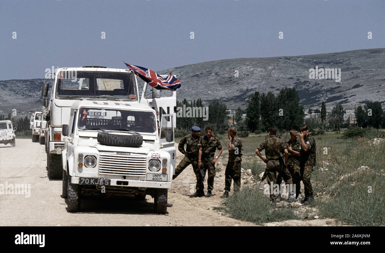 5th July 1993 During the war in Bosnia: British soldiers relax next to a  line of military trucks, halted at an HVO checkpoint on Route Circle, just  north of Tomislavgrad in western