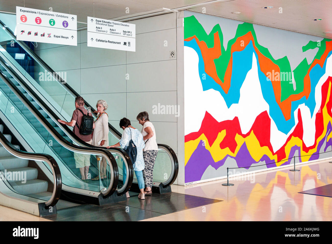 Barcelona Spain,Catalonia Montjuic,CaixaForum,contemporary art museum gallery,interior inside,lobby,Sol Lewitt,mural,Splat Wall Drawing 1011,escalator Stock Photo