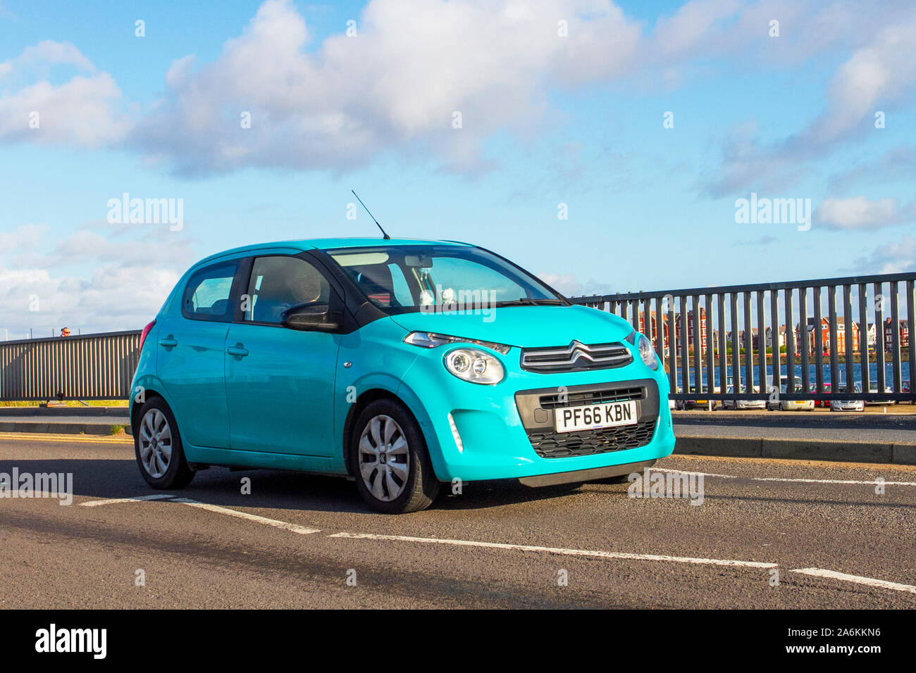 2016 blue Citroën C1 Feel Puretech driving on the seafront promenade, Southport, Merseyside, UK Stock Photo