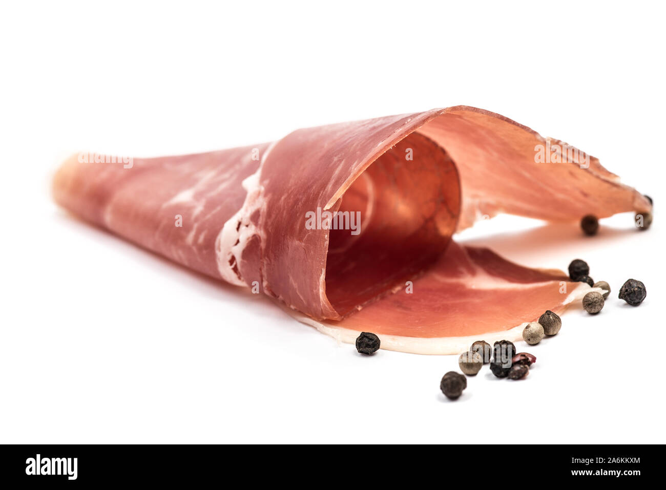 Swirl twisted thin sliced pork jamon slices isolated on white background Stock Photo