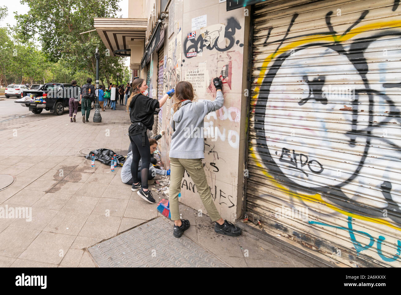 'Santiago de Chile Chile 26/10/2019 Real people help on cleaning the streets and recover normality during the latest riots at Santiago de Chile Stock Photo