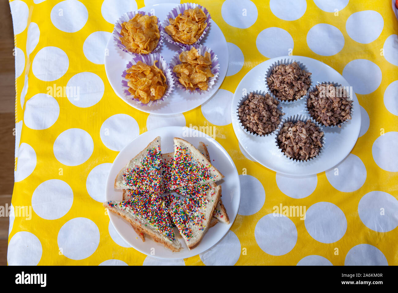 A party spread of Fairy Bread, Honey Joys and Chocolate Crackles Stock Photo