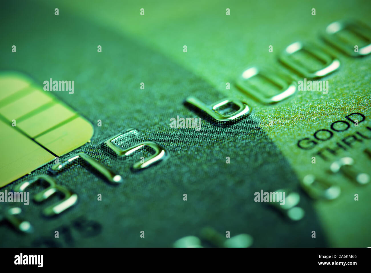 Green toned credit card macro view. Fake card numbers Stock Photo