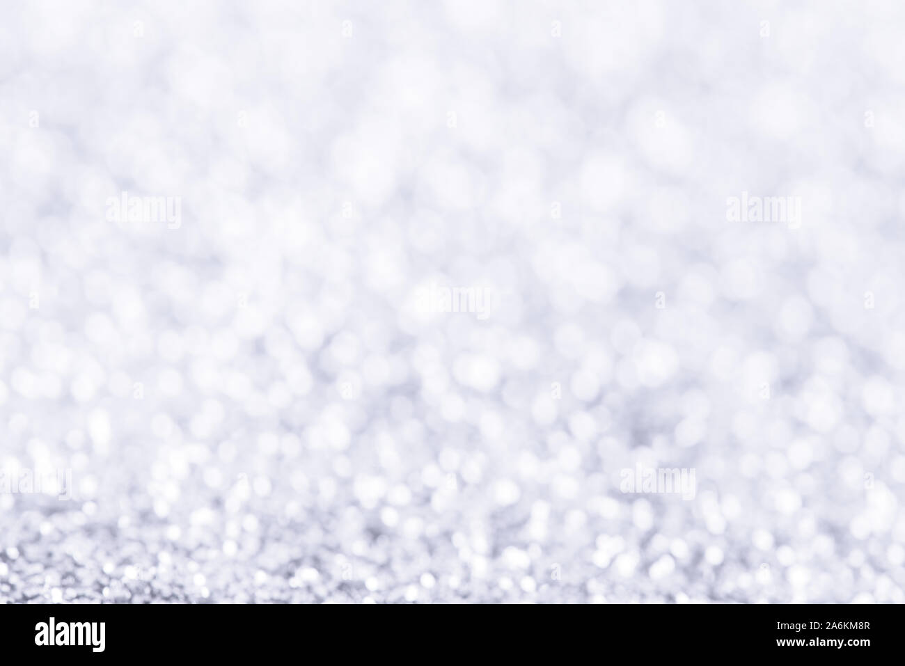 Abstract winter Christmas light blue background with bokeh. Defocused sparkle snow Stock Photo