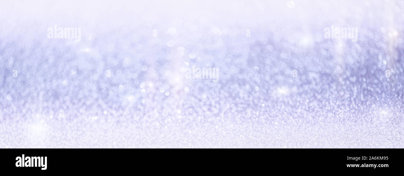 Abstract winter snow Christmas light blue background with bokeh. Defocused sparkle snowflakes Stock Photo