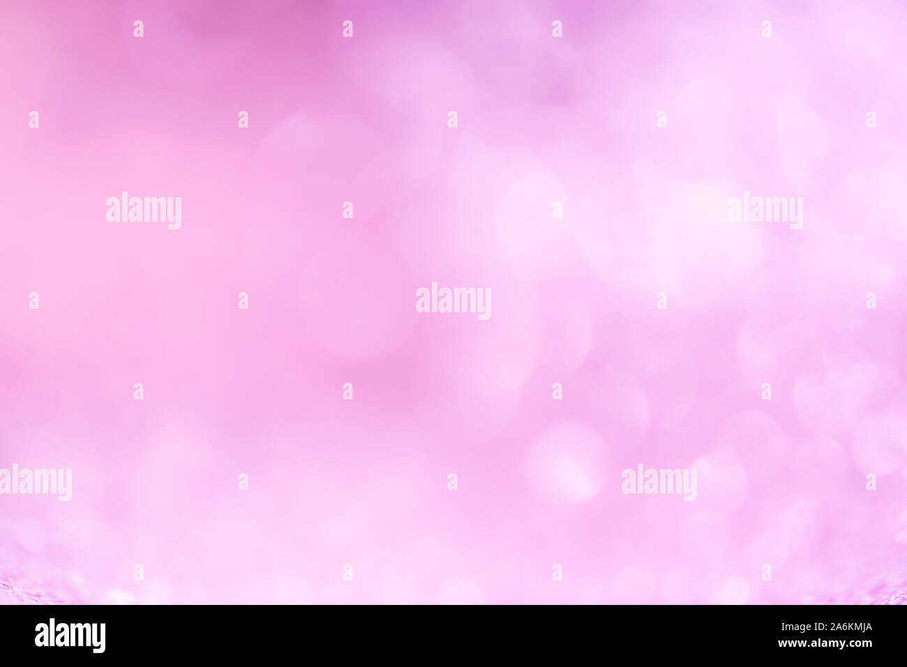 Abstract blurred pink tone glowing Christmas lights background Stock Photo