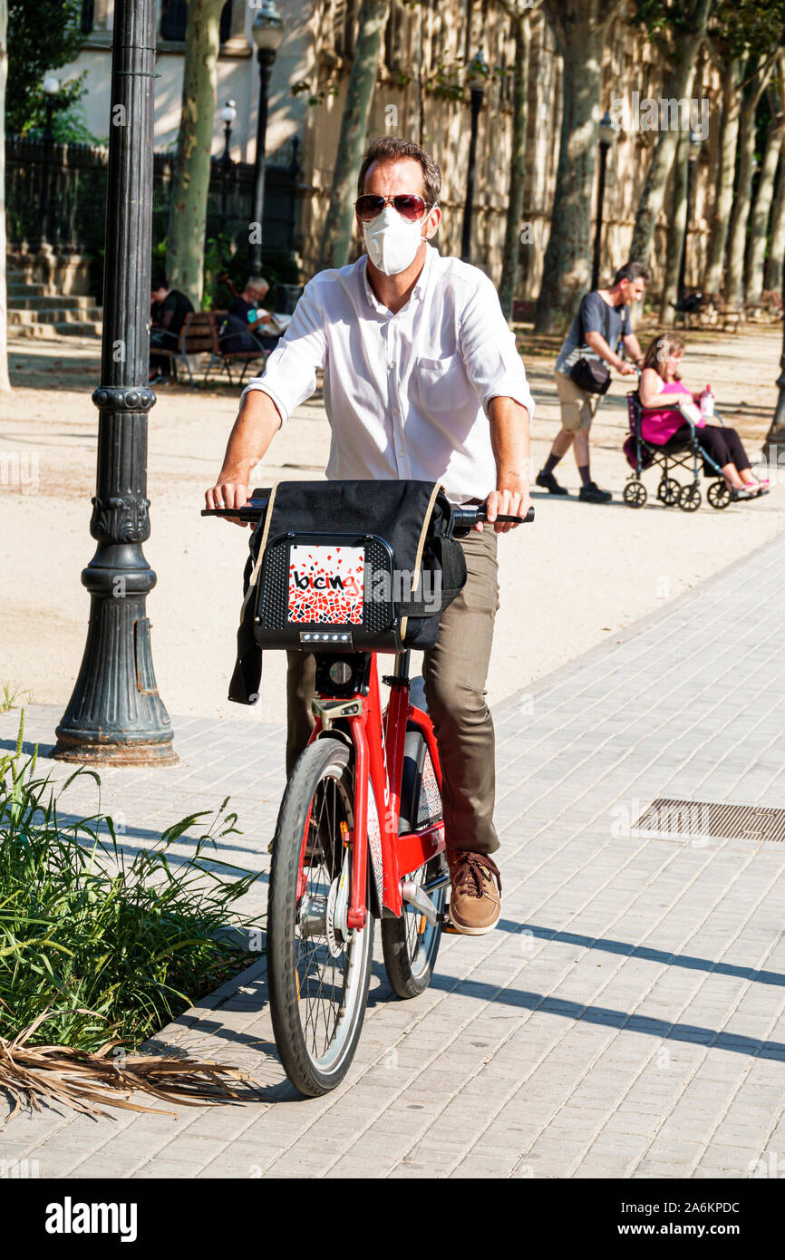 Barcelona Spain,Catalonia Catalunya,El Born,historic district,Ciutat Vella,man men male adult adults,riding bicycle bicycles bicycling riding biking r Stock Photo