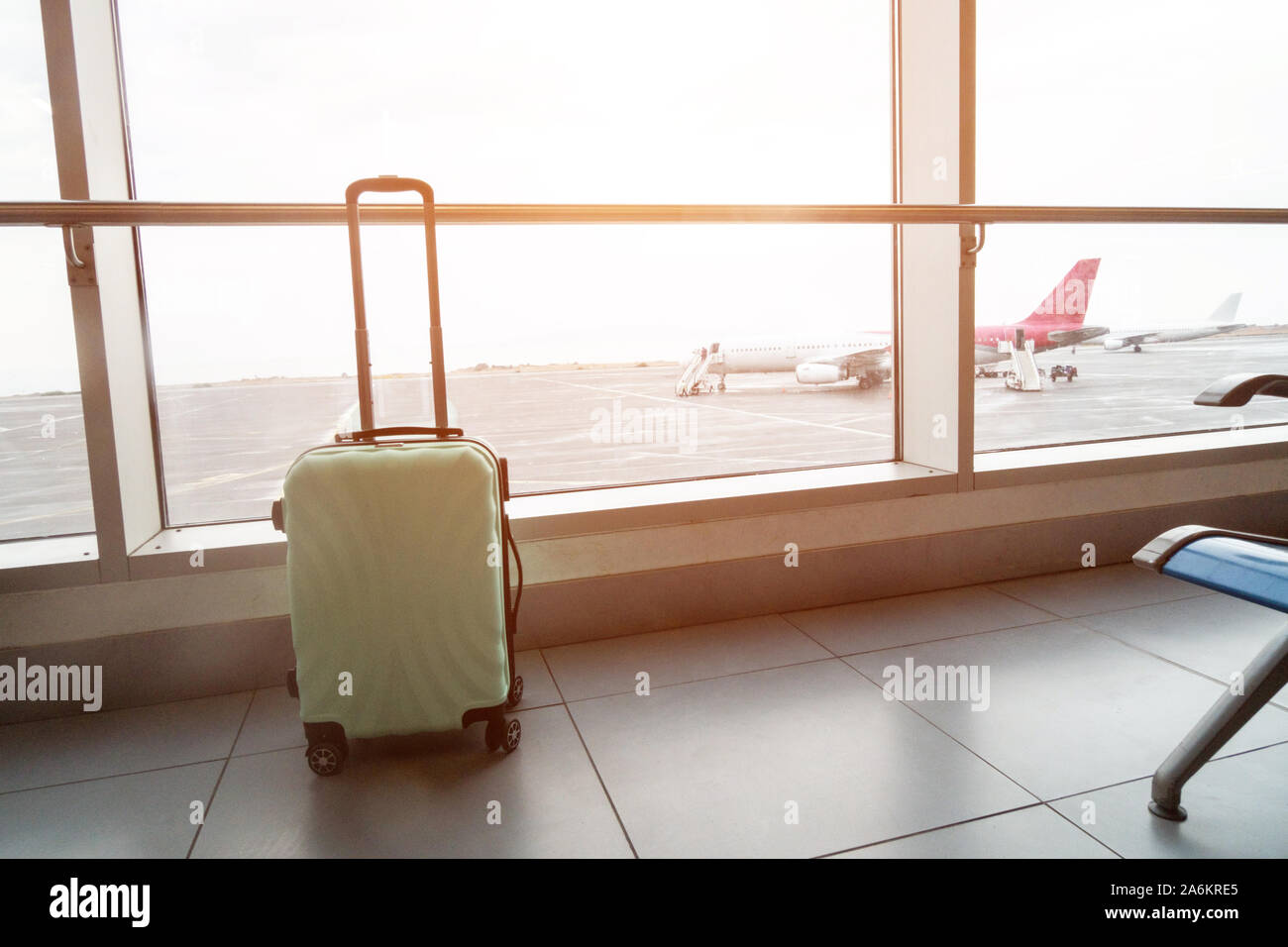 suitcase near window in the airport terminal Stock Photo Alamy