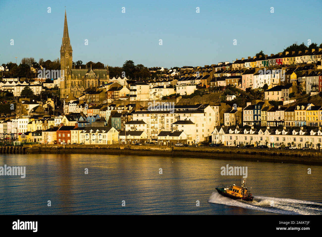 The pilot's boat accompanies the ferry in Cork Bay. Harbor view of Cork in Ireland Stock Photo