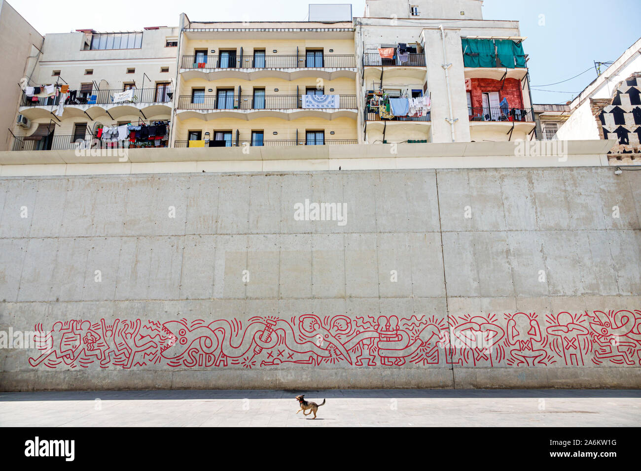 Barcelona Spain,Catalonia Ciutat Vella,El Raval,plaça de Salvador Segui,Keith Haring,mural,replica,AIDS awareness,1989,public art,dog,ES190824050 Stock Photo