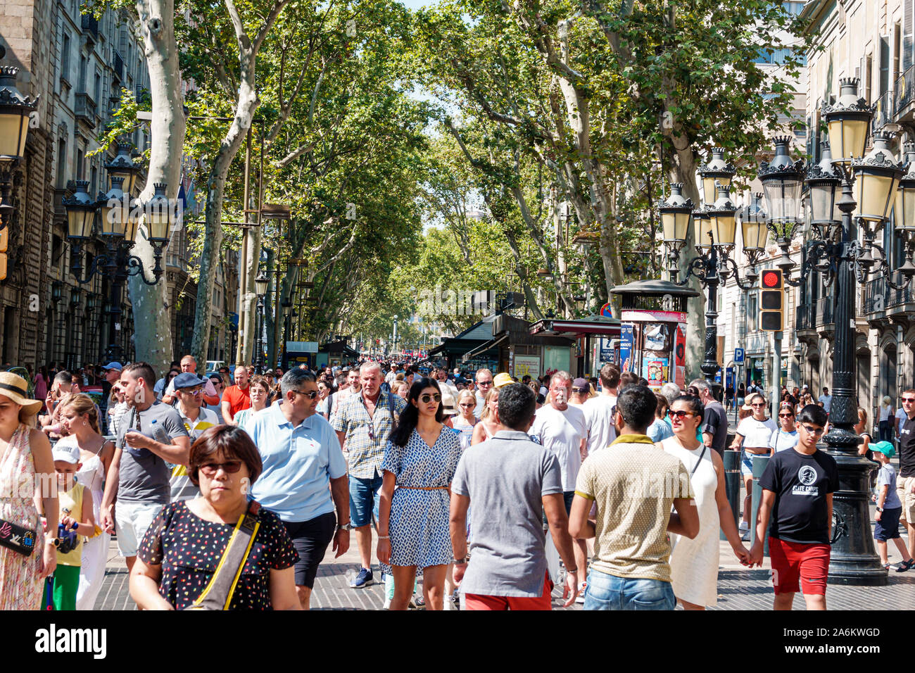 Barcelona Spain,Catalonia Ciutat Vella,Barri Gotic,La Rambla,tree-lined pedestrian street promenade,pedestrians,man,woman,crowded,Hispanic,ES190824104 Stock Photo