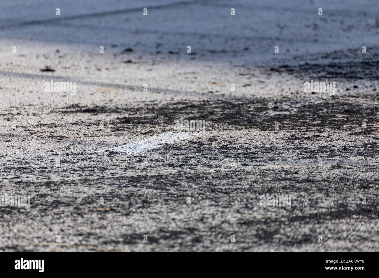 Burned rubber from a drifting race on the side of a track Stock Photo