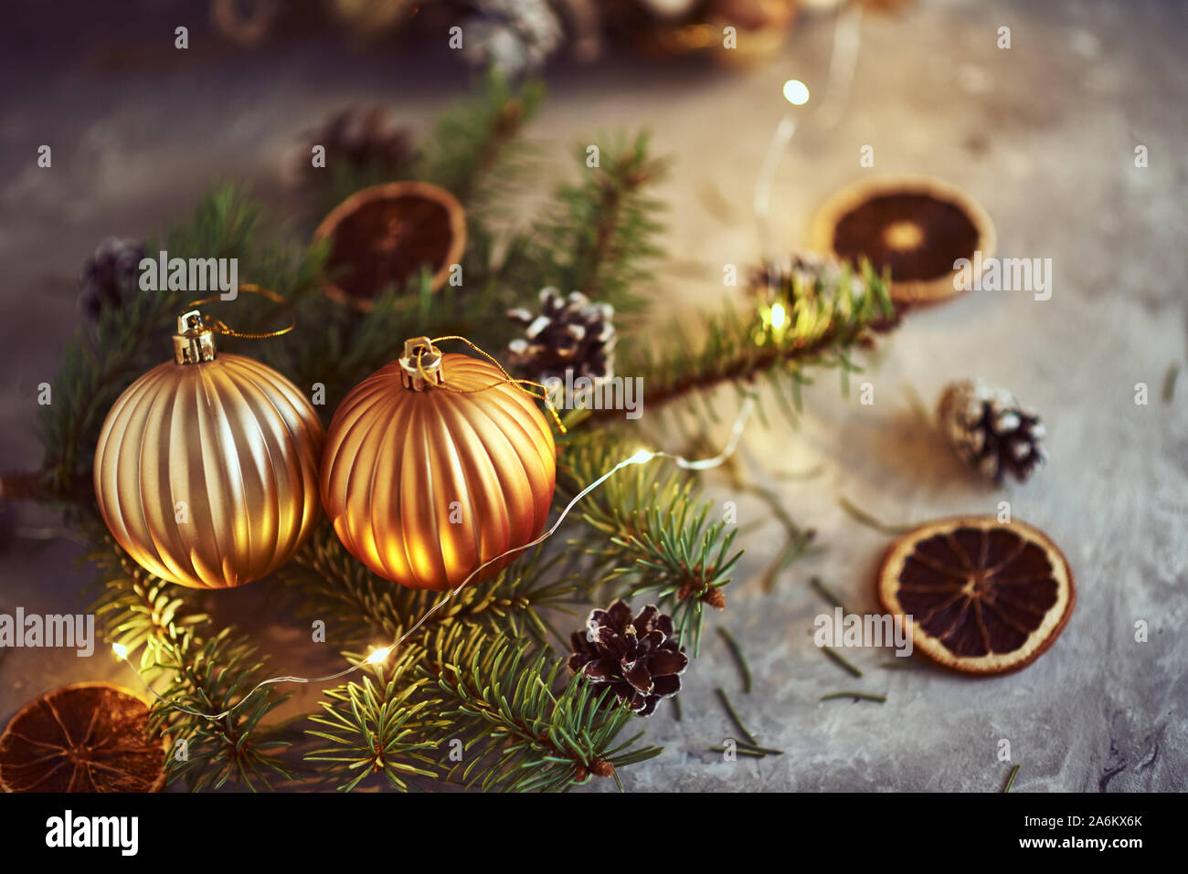 Christmas decorations with golden balls, fir tree branch and garland ...