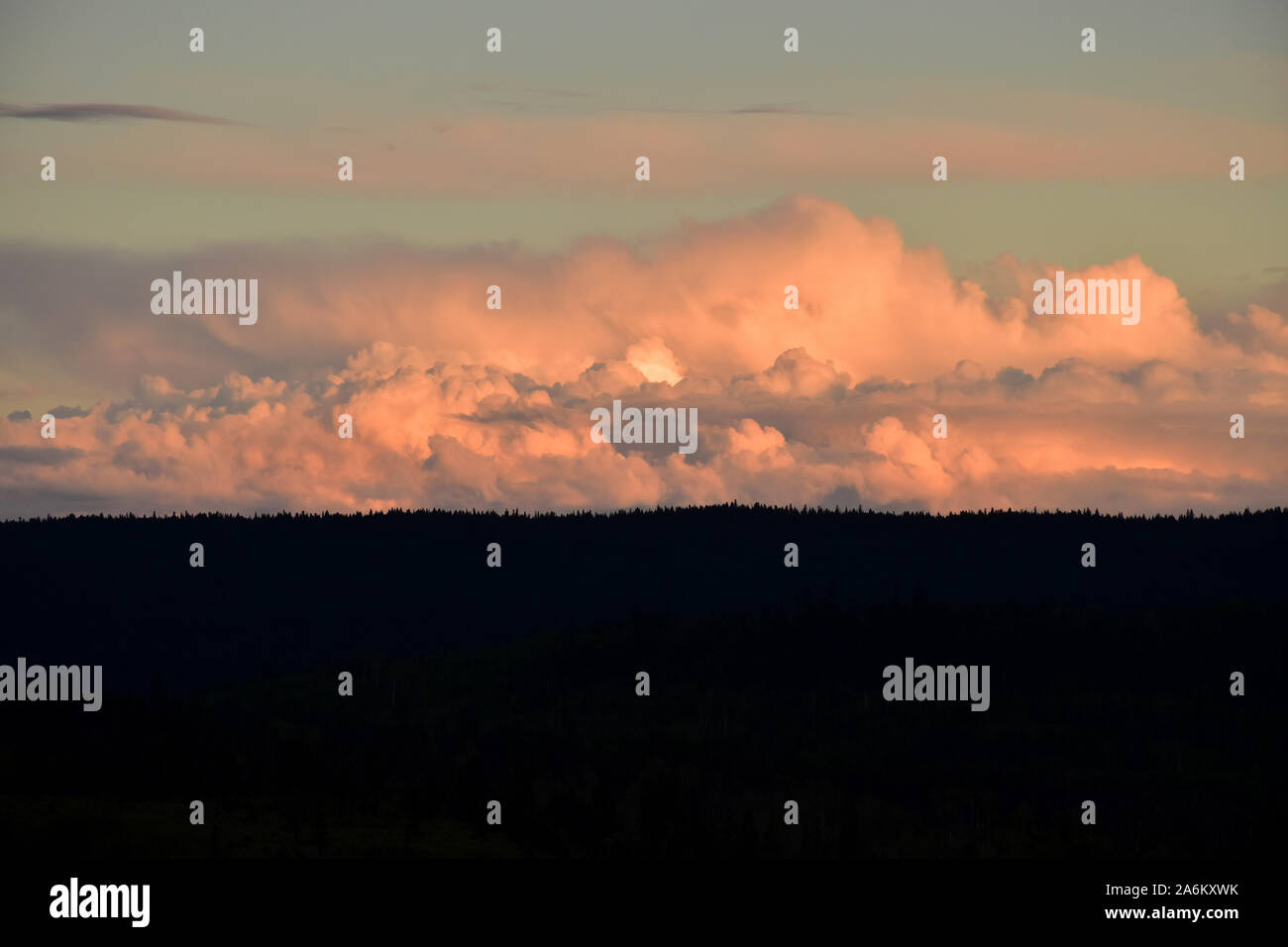 Puffy cumulonimbus clouds at sunset Stock Photo
