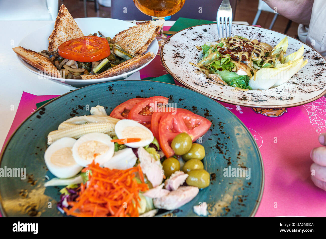 Valencia Spain Hispanic,Ciutat Vella,old city,historic center,Plaza Placa de la Reina,main square,Restaurante Bertal,restaurant,cafe,food plates,salad Stock Photo