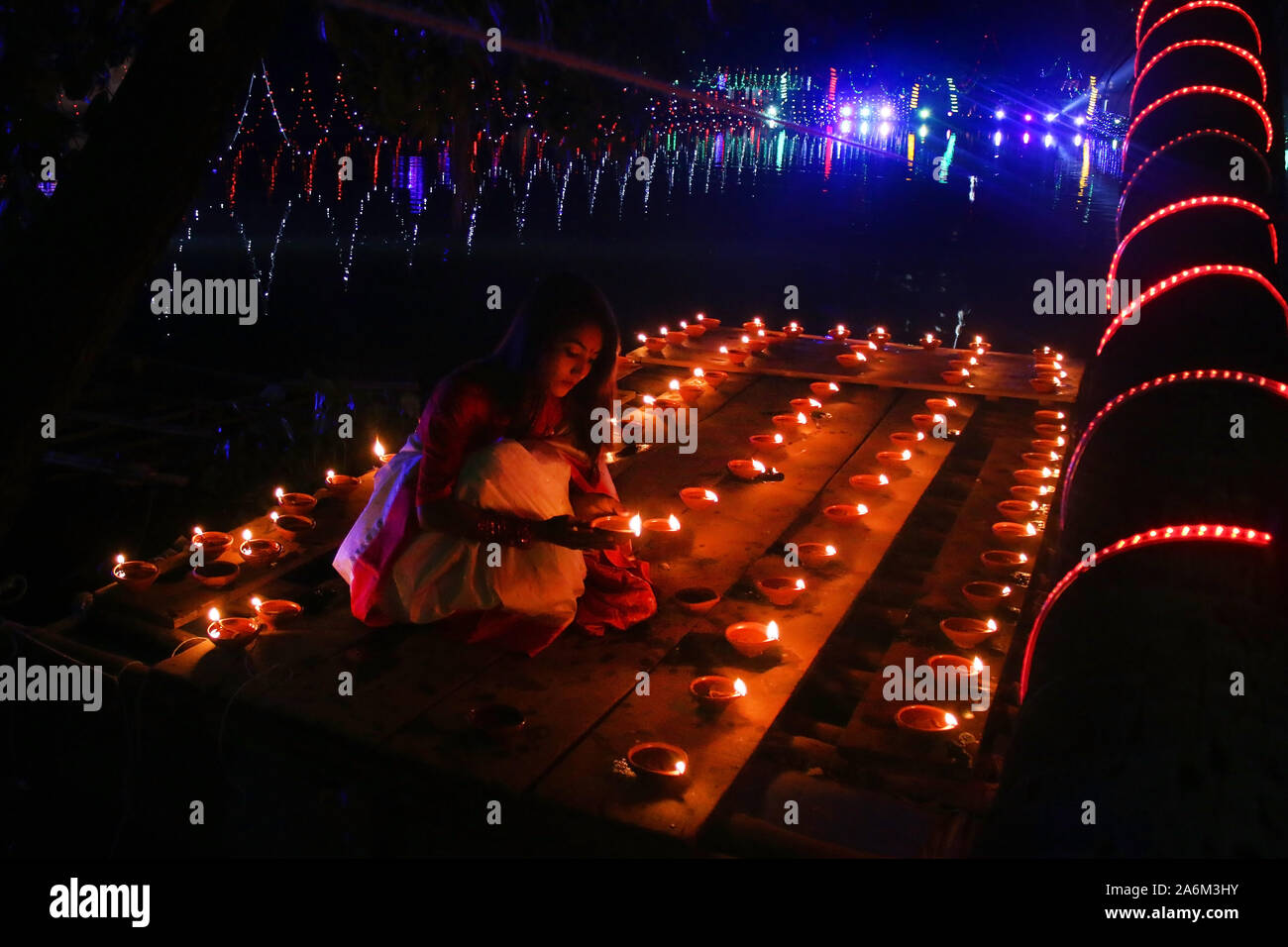 A Bangladeshi Girl Lights Oil Lamps As She Celebrates The Diwali Festival At A Temple In