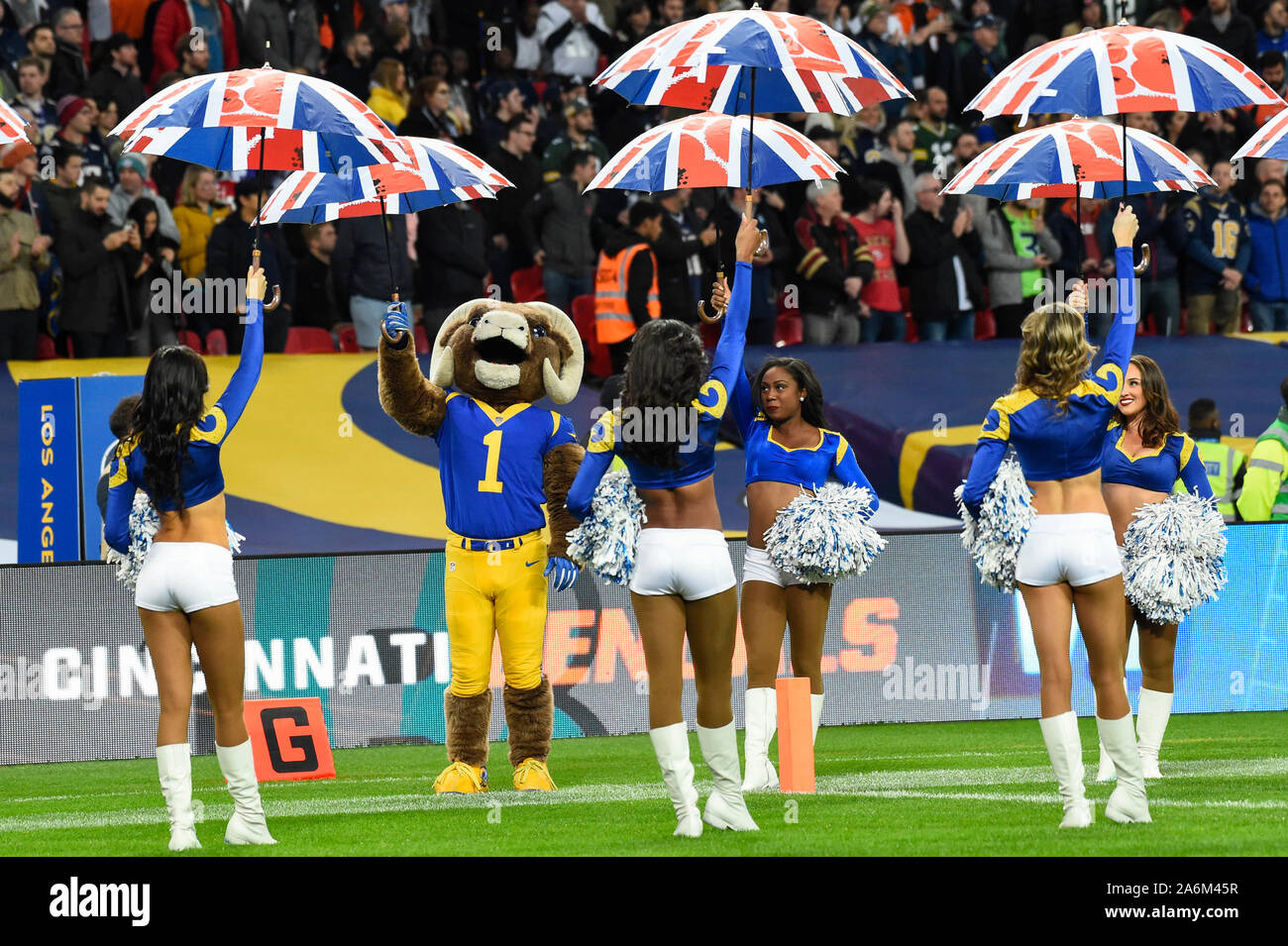 London, UK.  27 October 2019. Rams mascot and cheerleaders and Union Jack umbrellas ahead of the NFL match Cincinnati Bengals v Los Angeles Rams at Wembley Stadium, game 3 of this year's NFL London Games.  Credit: Stephen Chung / Alamy Live News Stock Photo