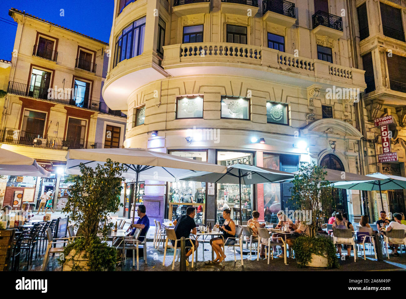 Valencia Spain Hispanic,Ciutat Vella,old city,historic center,Plaza del Mercat,Birra & Blues,restaurant,bar,night evening,al fresco dining,tables,umbr Stock Photo