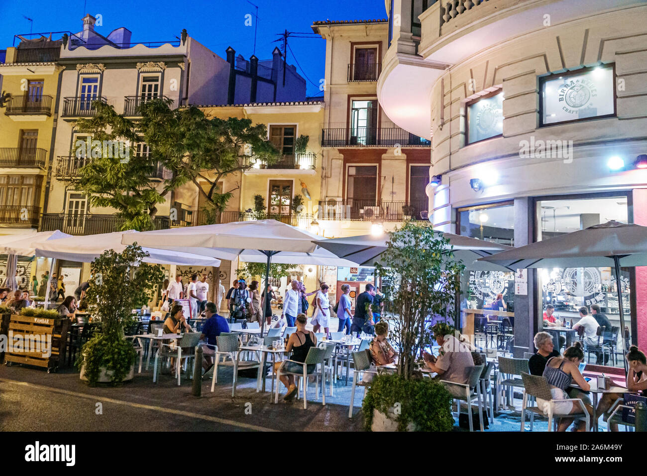 Valencia Spain Hispanic,Ciutat Vella,old city,historic center,Plaza del Mercat,Birra & Blues, restaurant,bar,night evening,al fresco dining,tables,umb Stock Photo