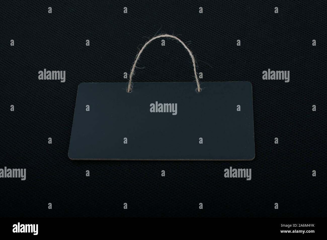 Rectangular shaped black notice board on black background Stock Photo