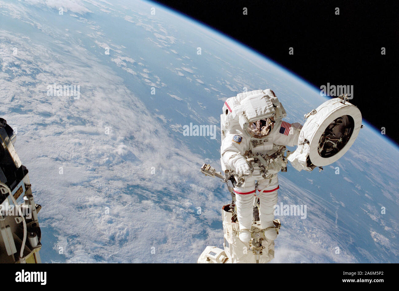 Astronaut Franklin R. Chang-Diaz works with a grapple fixture during extravehicular activity (EVA) to perform work on the International Space Station (ISS) Stock Photo