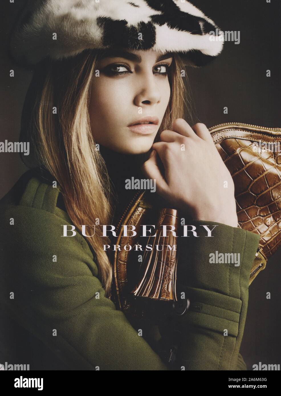 poster advertising Burberry fashion house with Cara Delevingne in paper  magazine from 2011 year, advertisement, creative Burberry advert from 2010s  Stock Photo - Alamy