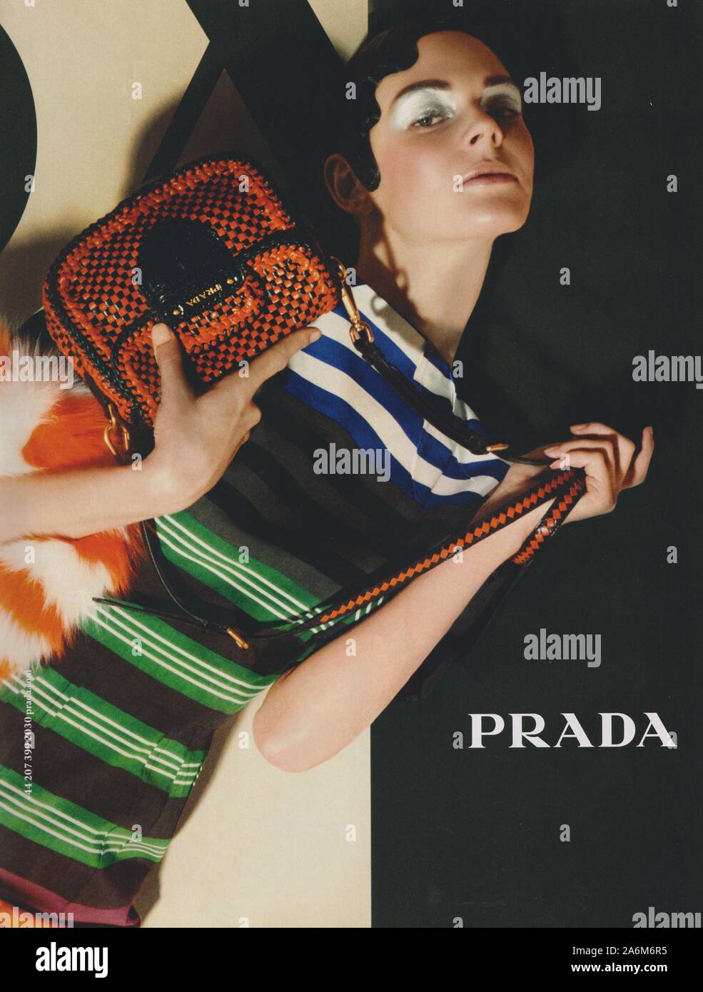 poster advertising PRADA fashion house in paper magazine from 2011 year,  advertisement, creative PRADA advert from 2010s Stock Photo - Alamy