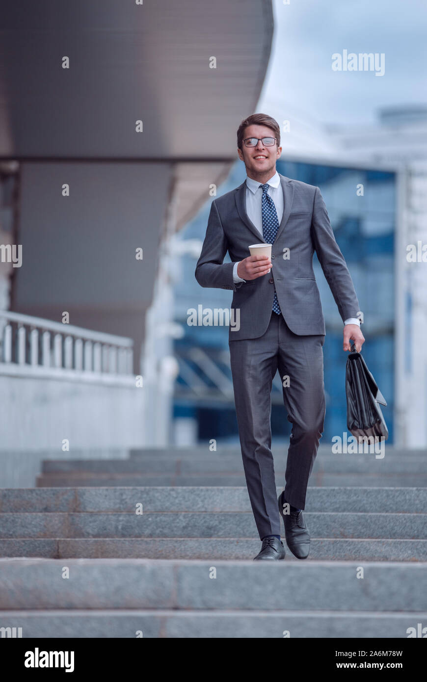 business man walking down the street of a big city Stock Photo - Alamy