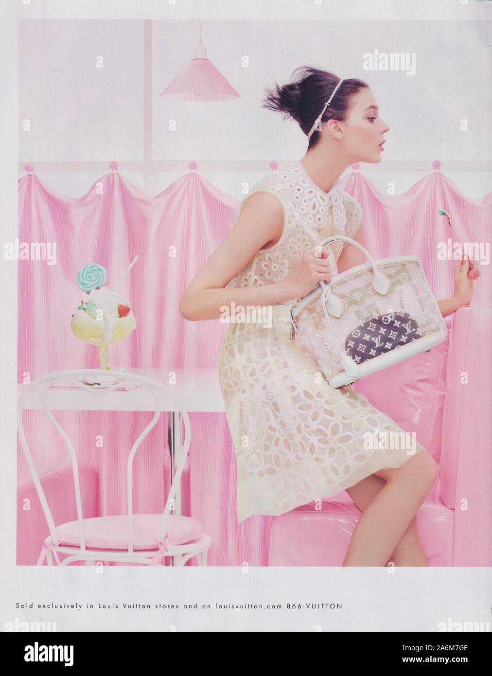 poster advertising Louis Vuitton handbag with Kati Nescher in paper magazine from 2012 year, advertisement, creative advert from 2010s Stock Photo