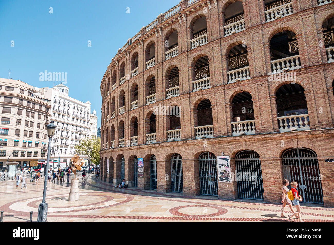 Valencia Spain,Plaza de Bous,bullring,1850,neoclassical style architecture,exterior,arches,by Sebastian Monleon Estelles,pedestrians,ES190831069 Stock Photo
