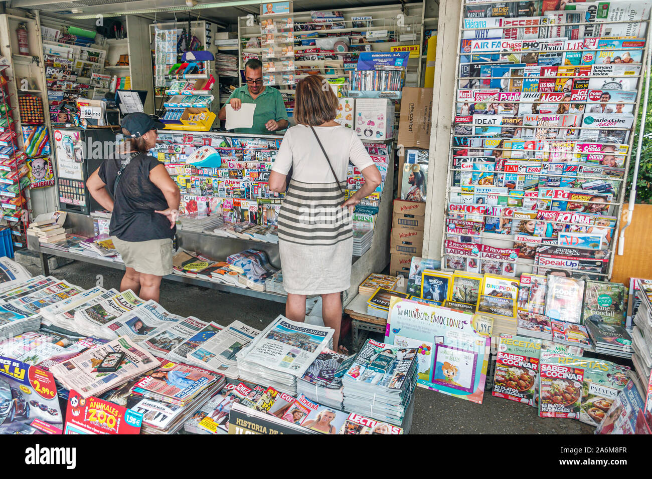 Barcelona Spain,Catalonia Les Corts,Avinguda Diagonal,newsstand,kiosk,newspapers,magazines,vendor,woman,man,customer,ES190901011 Stock Photo