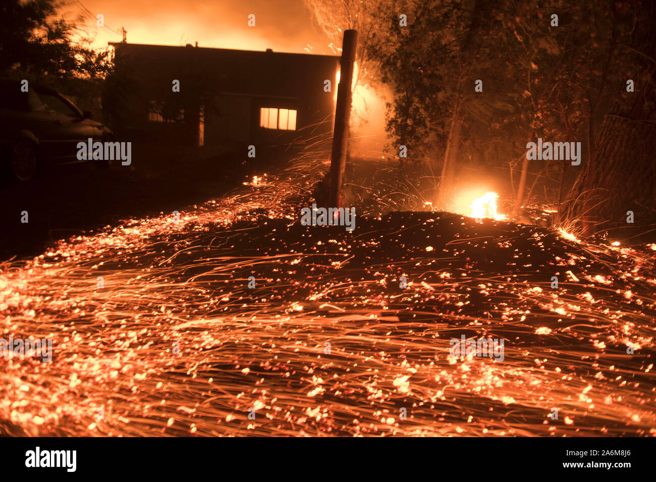 Healdsburg, United States. 27th Oct, 2019. Thousands of little spot fires burn from wind driven embers in Healdsburg, California early Sunday, October 27, 2019. Over 200,000 people have been evacuated in Northern California as winds clocked as high as 93 MPH fanned flames. Photo by Terry Schmitt/UPI Credit: UPI/Alamy Live News Stock Photo