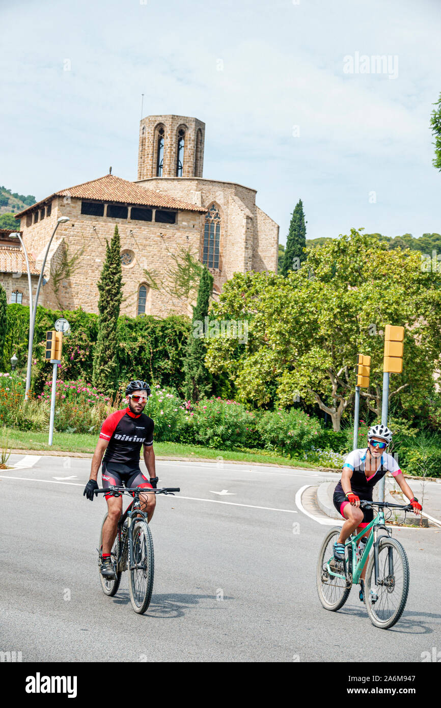 Barcelona Spain,Catalonia Monastery of Pedralbes,bicycles,cyclist,riding,fitness,man,helmet,free-hand balancing,man,friends,Hispanic,ES190901064 Stock Photo