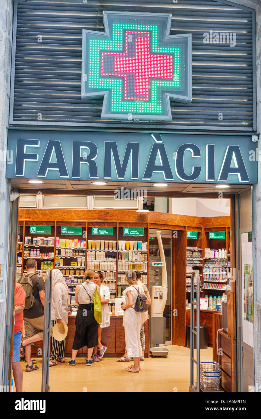 Barcelona Spain,Catalonia Passeig de Gracia,Farmacia La Pedrera,pharmacy,drug store,front entrance sign,customers,ES190901137 Stock Photo