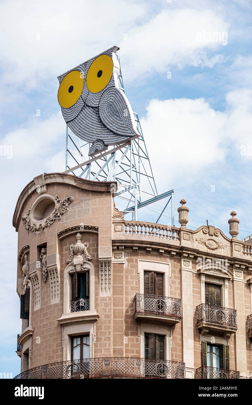 Barcelona Spain,Catalonia Eixample,Plaza de Mosen Jacinto Verdaguer,Avinguda Diagonal,Rotulos Roura building,city emblem,illuminated owl sign,rooftop, Stock Photo