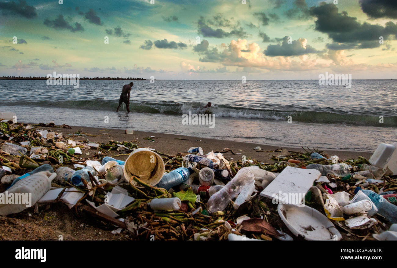 pollution on the beach of the caribbean coast in dominican republic. Stock Photo