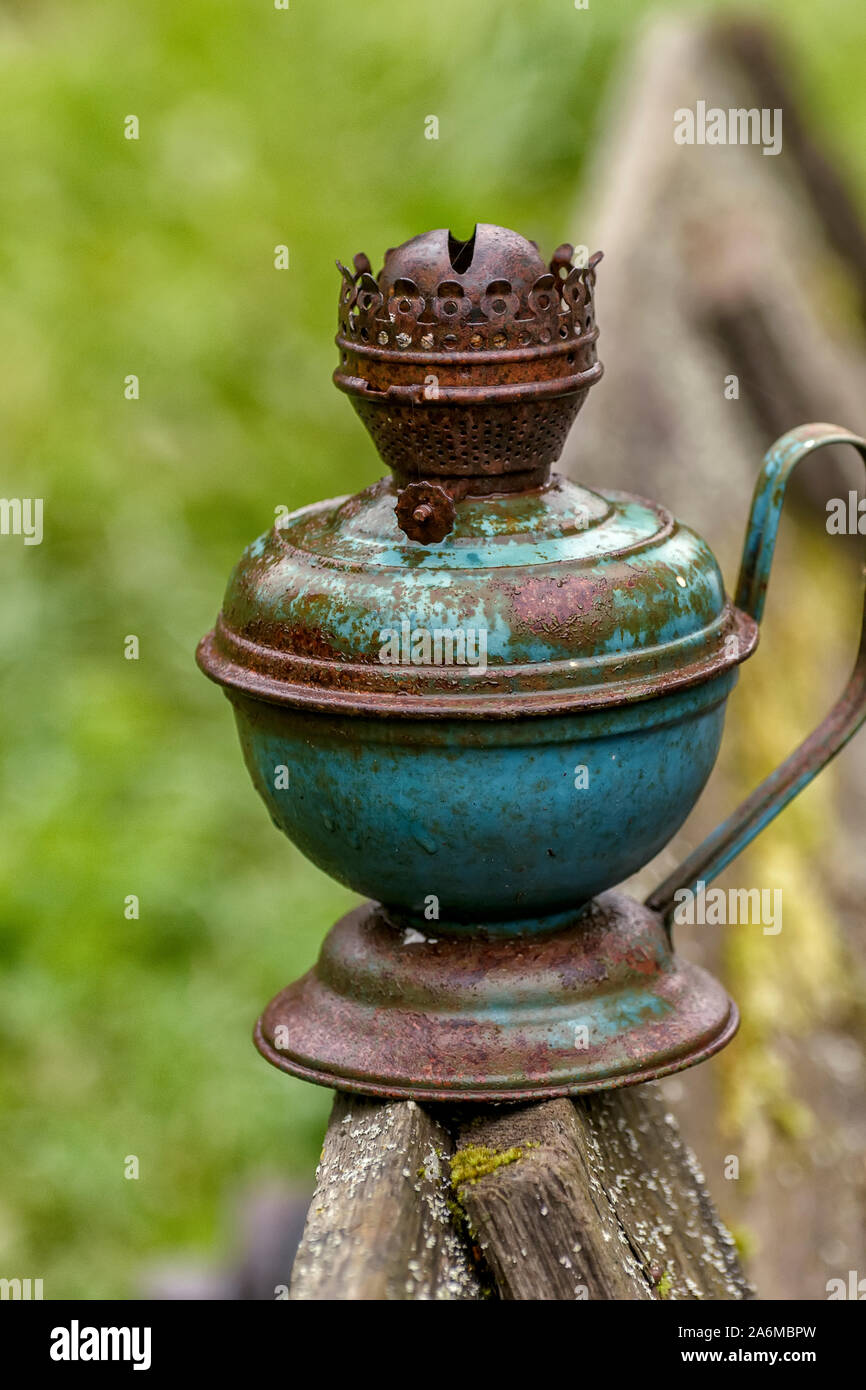 An old kerosene lamp, out of use. Ancient lighting device Stock Photo