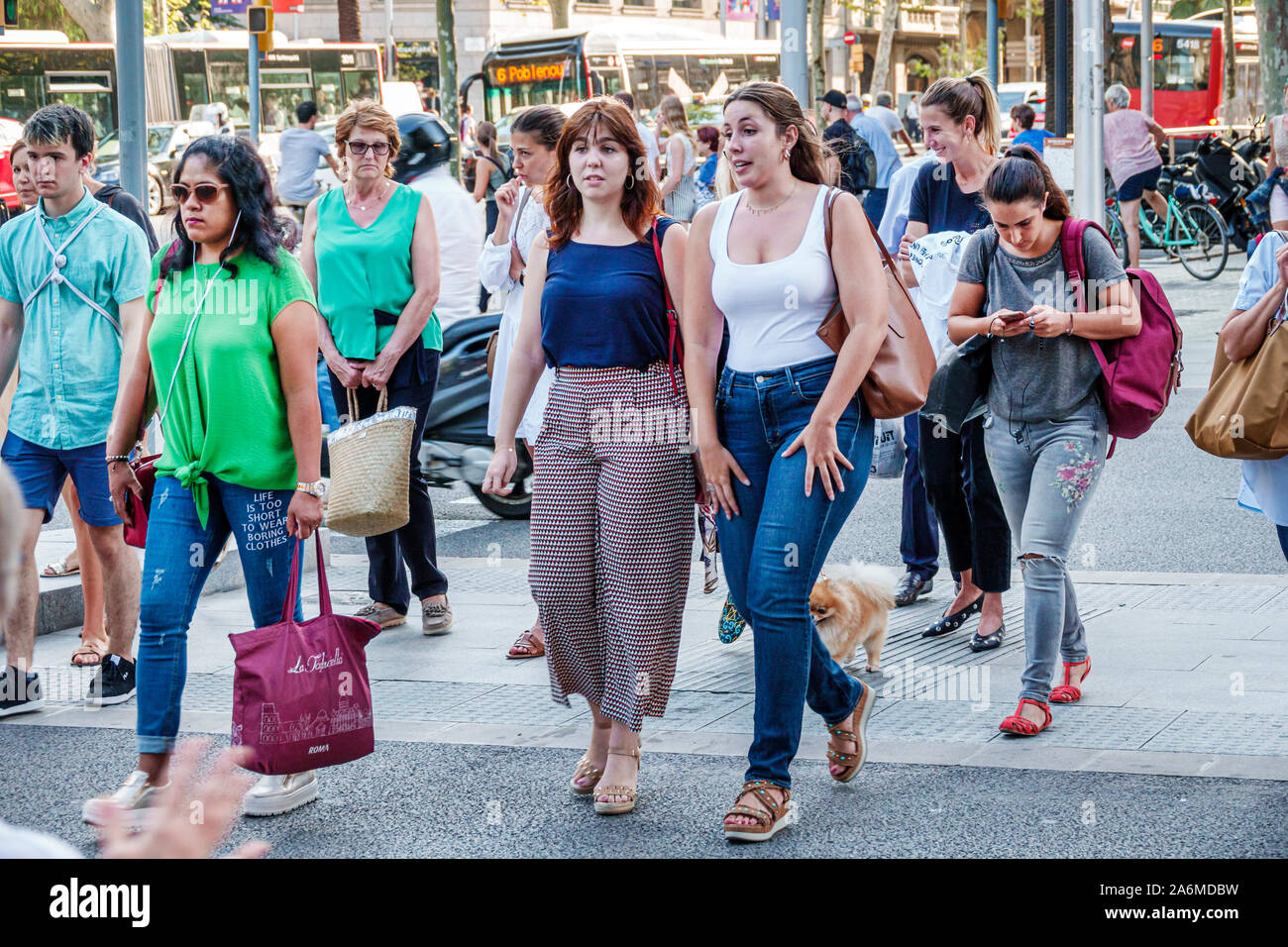 Barcelona Spain,Catalonia Catalunya,Eixample,Avinguda Diagonal,major thoroughfare,wide sidewalk,busy,pedestrians,woman women female lady adult adults, Stock Photo