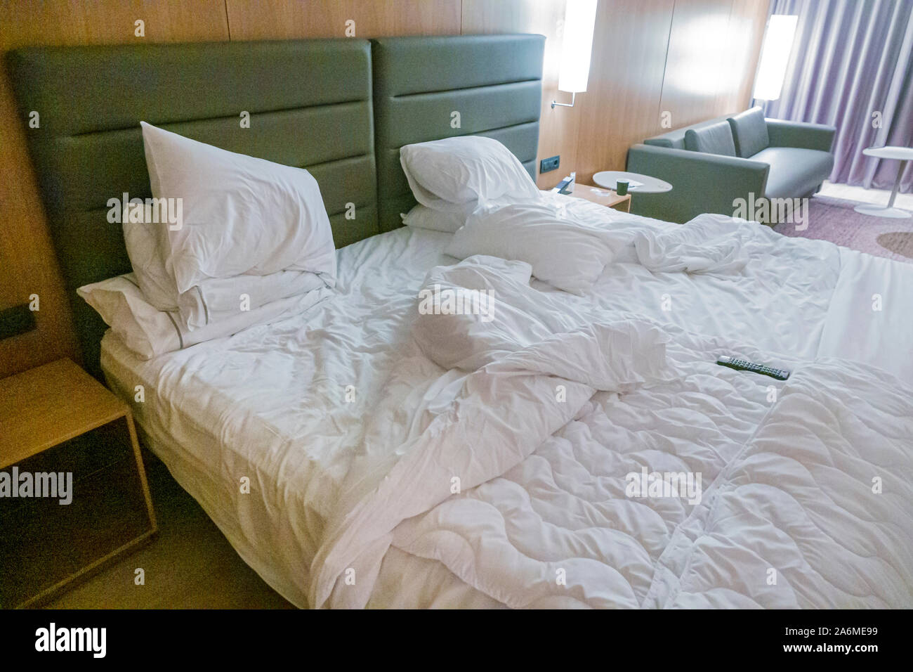 Barcelona Spain,Catalonia Les Corts,AC Hotel Diagonal L’Illa,hotel,guest room,king bed,unmade,crumpled messy bedding,down comforter,pillows,ES19090409 Stock Photo